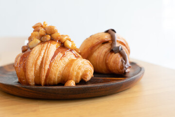 delicious homemade croissant on the wooden table in kitchen prepare for breakfast
