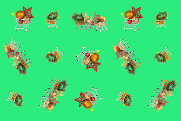 Supermarket baskets with decorations and holiday toys, are chaotically isolated on a green background.