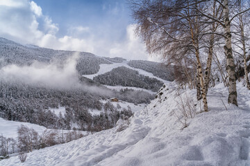 Landscape with Pyrenees Mountains in Andorra , Grandvalira ski area in El Tarter in winter day .