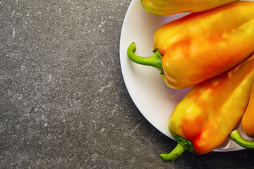 Fragment of sweet bell peppers on a plate for background