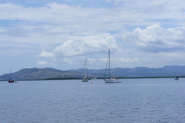 Yachts on the roadstead in the bay near the town of Nadi on the island of Viti Levu in the archipelago of Fiji