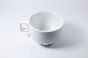 White cup of coffee or tea on a white background