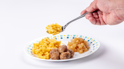 Children’s Meatball and Macaroni TV dinner with spoon
