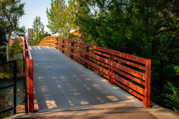 Bridge leads over the Boise River to university campus