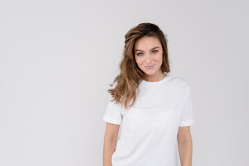 Portrait of young cheerful smiling woman, over white background