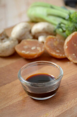 soy sauce, kecap manis, in a glass bowl