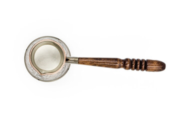Copper Turk or Cezve with a wooden handle for brewing coffee isolated on a white background. empty, top view.