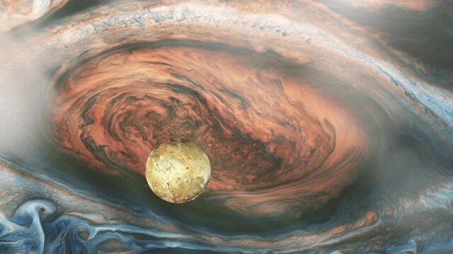 Io, One of the four Galilean Moons orbiting Jupiter, passing over the Great Red Spot. Elements of this video furnished by NASA.