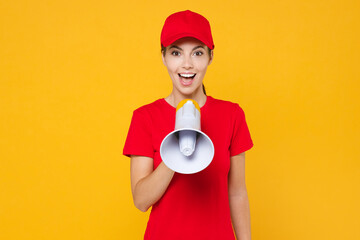 Fun crazy delivery employee woman in red cap blank t-shirt uniform work courier in service scream...
