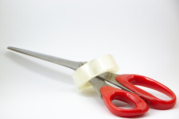 scissors and a tape isolated on a white background