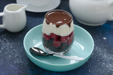 Trifle with raspberry cream and chocolate sauce