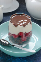 Trifle with raspberry cream and chocolate sauce