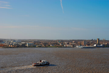 Obraz premium The River Mersey separating Liverpool and The Wirral, UK