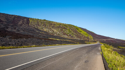 Highway on a volcanic landscape. Amazing scenery. Hawaii.