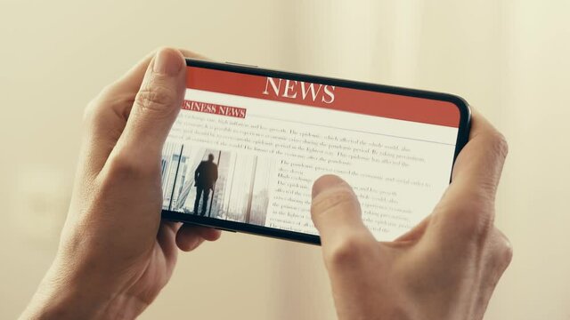 Reading news on mobile phone