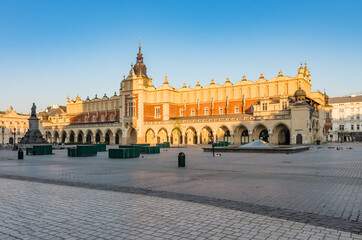 Naklejka na ściany i meble Krakow, Poland, Cloth Hall on the Main Square in the morning sunlight