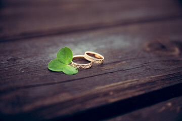 wedding rings on a wooden background