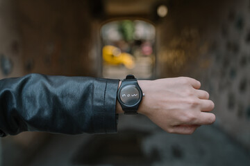 Time is now! symbolic motivational photo woman hand watch. symbol time flies fast motivation don't waste and live active. lather black jacket. planning, checking and scheduling. Keep up with plans