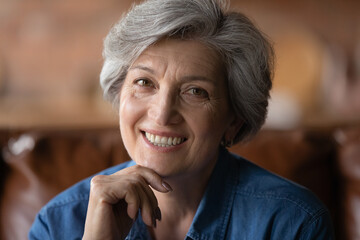 Close up portrait of smiling mature Caucasian grey-haired woman feel optimistic positive about healthy elderly life, profile picture of happy senior 60s grandmother in high spirit, healthcare concept - obrazy, fototapety, plakaty