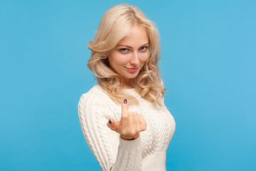 Beautiful playful woman with curly blond hair inviting, calling with finger, flirt and seduction,...
