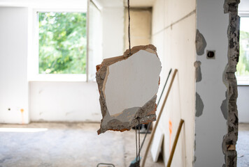 apartment renovation piece of wall hanging on reinforcement