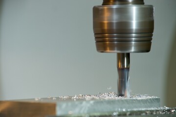 Machine Machining of metals, milling and grinding, CNC machines, robotic machined metals.
