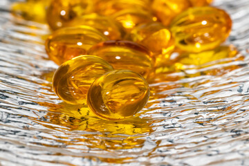 Capsules fish oil yellow sleep gray background