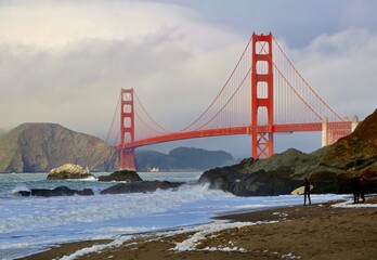 surfer by the golden gate bridge