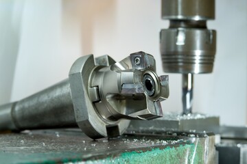Machine Machining of metals, milling and grinding, CNC machines, robotic machined metals.