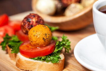 Aromatic Chevre cheese in olive oil on bruschetta, close up