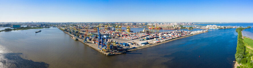 Fototapeta na wymiar Aerial view of cargo ship, cargo container in warehouse harbor in the Morskie Vorota district in St. Petersburg