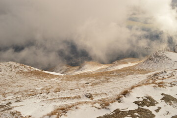 Hiking in the misty and dramatic Carpathian Mountain range in Romania, Eastern Europe