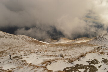 Hiking in the misty and dramatic Carpathian Mountain range in Romania, Eastern Europe