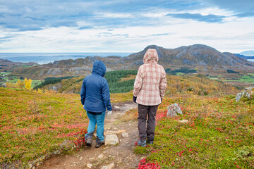 Fototapeta na wymiar Happy Woman hiking in the mountains, Northern Norway