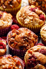 Homemade cinnamon muffins with fruits and nuts, focus on the muffin inside,  close-up view
