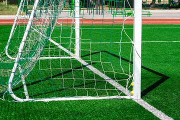 soccer gates. Football goal at the stadium. Football field with artificial lawn. Concept other...