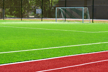 soccer gates. Football goal at the stadium. Football field with artificial lawn. Concept other party of soccer.  At stadium.
