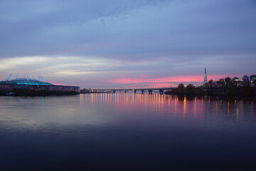 Landscape on the gulf of Finland in the city of saint petersburg where the sunset sky and the new stadium are reflected.