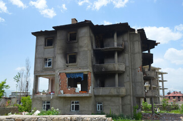 scars of war and conflict, a ruined building, a house