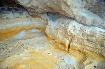 Layers of colored sand. Snow white quartz sand. Shore of Blue Lake in the Chernigow region, Ukraine.Former quarry of quartz sand for glass production.Popular local resort at present