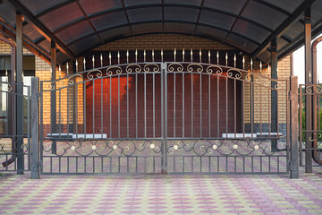 Transparent metal forged gate for entering a private house