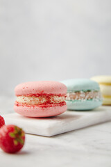 French cake macarons on a marble background