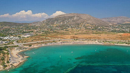 Aerial drone photo of famous organised beach and bay of Anavysos with crystal clear emerald sea...