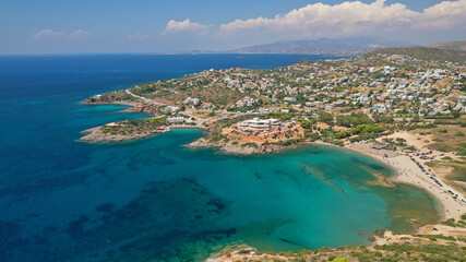 Aerial drone photo of famous islet, beach and bay of Agios Nikolaos in Anavysos area with crystal clear emerald sea, Athens riviera, Attica, Greece
