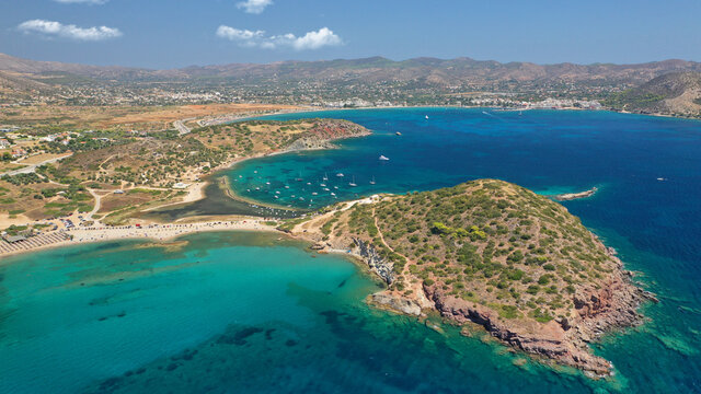 Aerial drone photo of famous islet, beach and bay of Agios Nikolaos in Anavysos area with crystal clear emerald sea, Athens riviera, Attica, Greece © aerial-drone