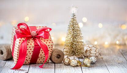Beautiful Christmas background with Christmas toys and a gift box.