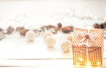 Festive new year background with a gift box and lights.