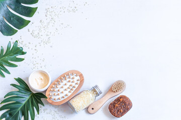 Spa composition with body care items and leaves.