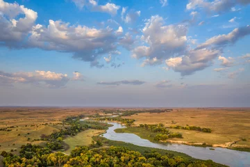 Fototapeten shallow and wide Dismal River flowing through Nebraska Sandhills at Nebraska National Forest, aerial view of afternoon scenery in early fall © MarekPhotoDesign.com