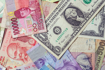 Fototapeta na wymiar Different money background. 1 dollar in center